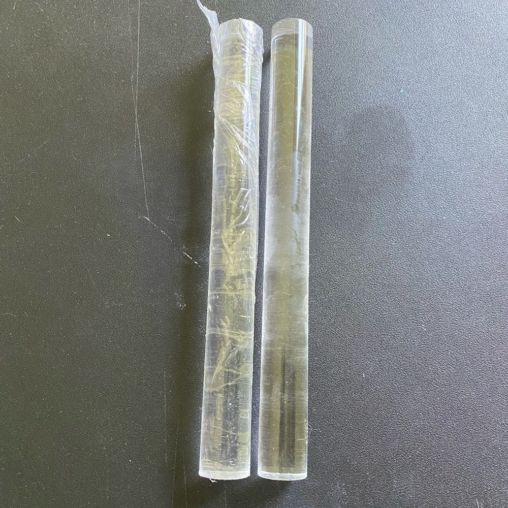 Clay rolling pin. One used the other in the wrapper.